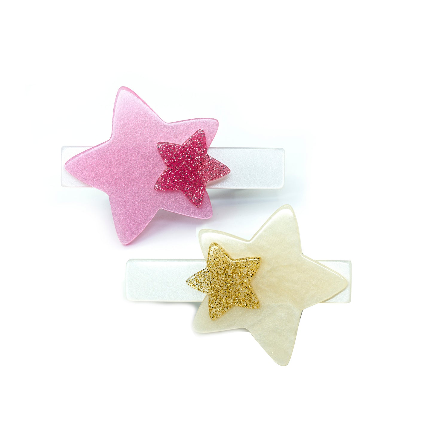 Set of two acrylic hair clips adorned with stars in pink and cream