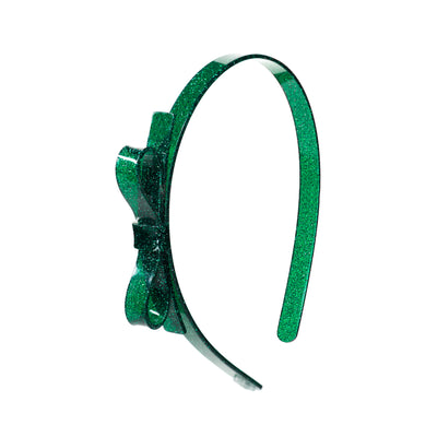 Acrylic headband adorned with a thin side bow. Green glitter. 